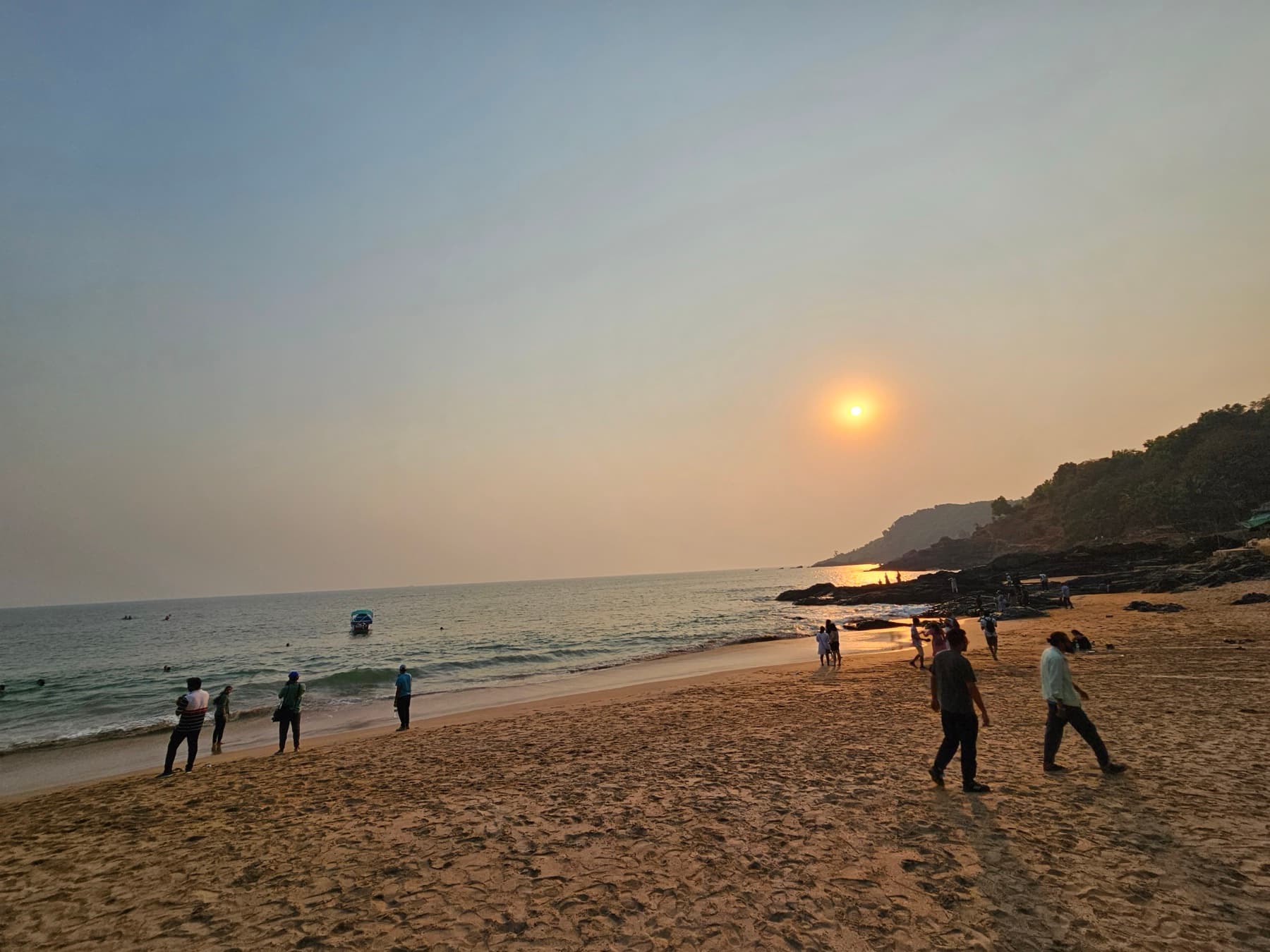 An evening beach walk at sunset