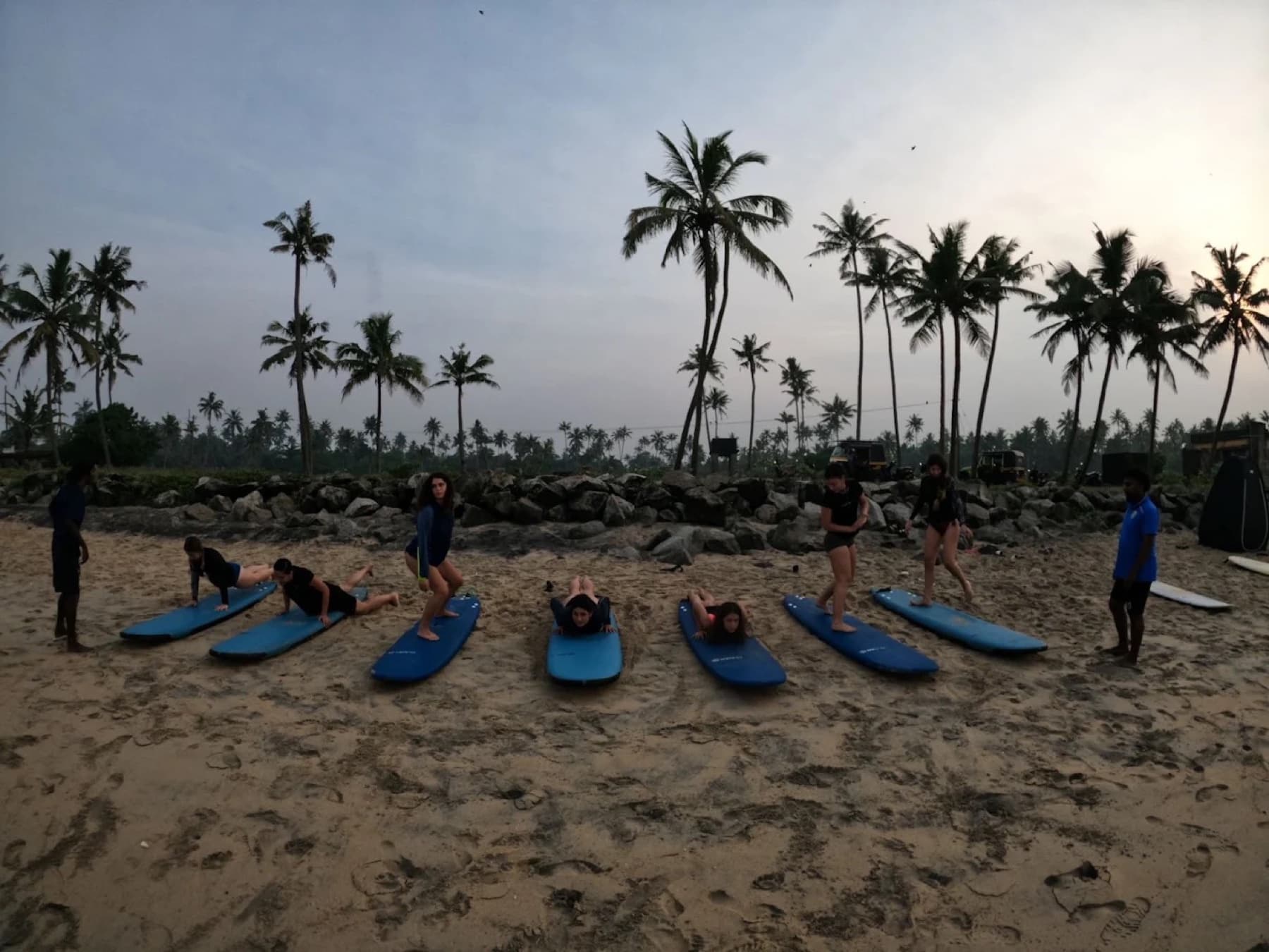 A surf lesson at sunset